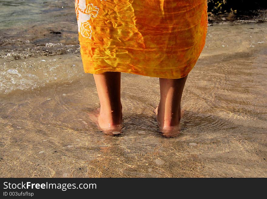 Feet in the ocean