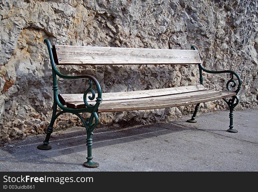 Old bench against rock