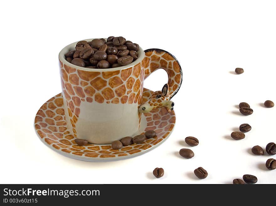 Cup of coffee simulating a giraffe with coffee grains in white background