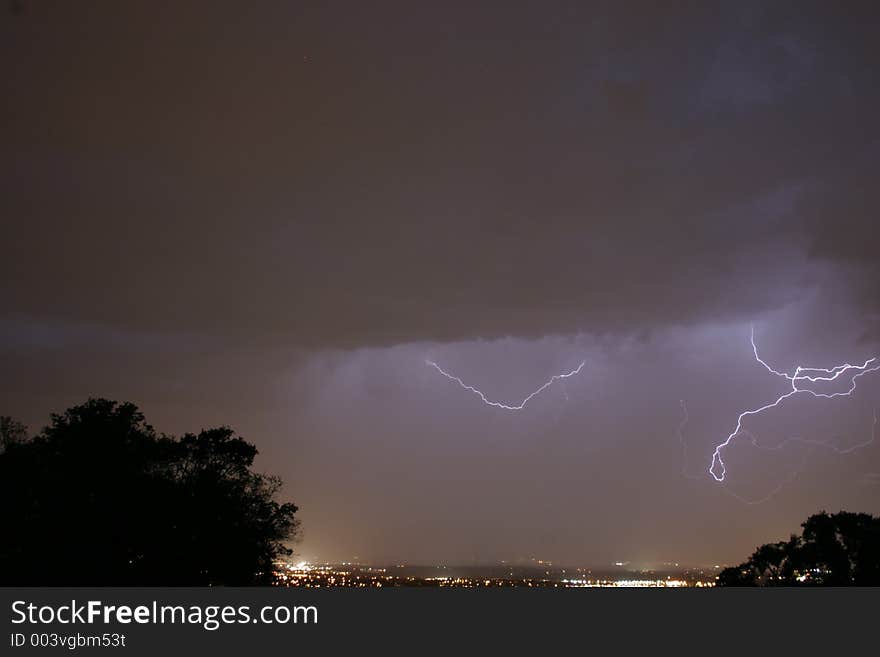 Lightning bolt striking in the night sky. Lightning bolt striking in the night sky.