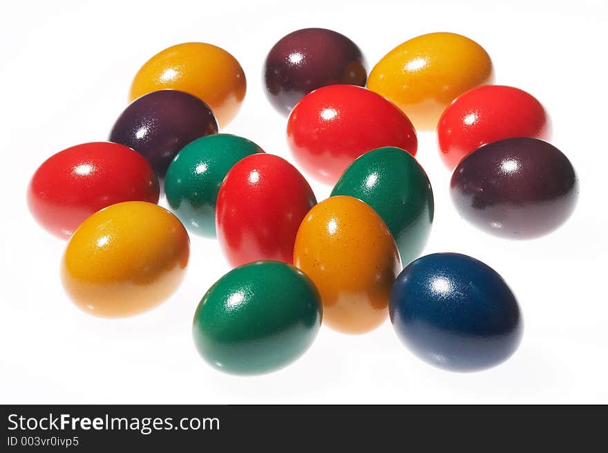 Many coloured eggs on white background. Many coloured eggs on white background