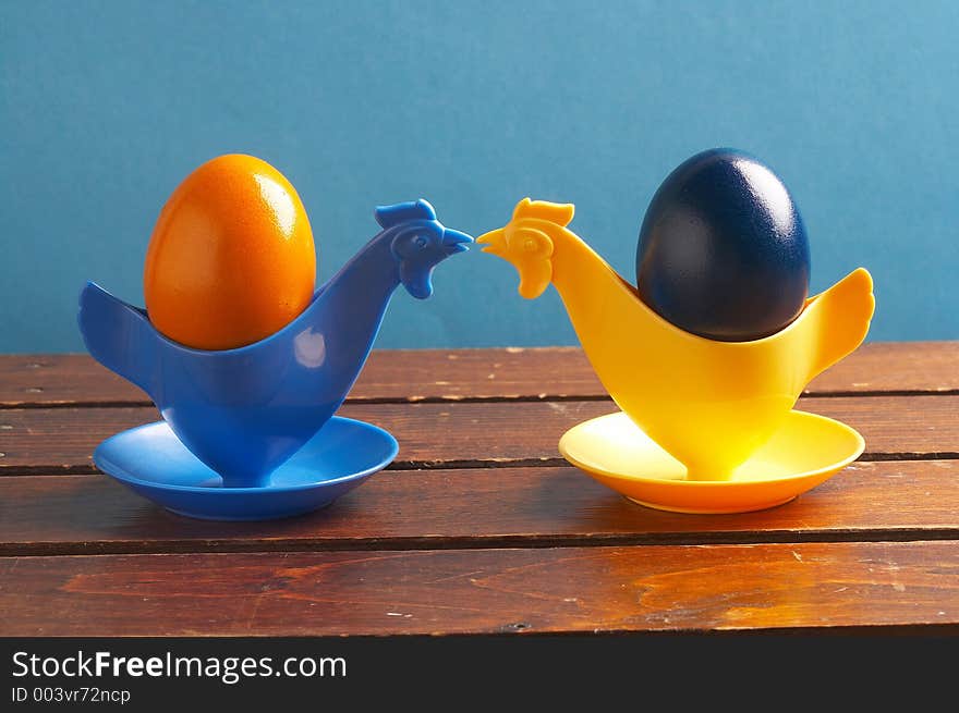 Two chicken- eggcups on a table. Two chicken- eggcups on a table