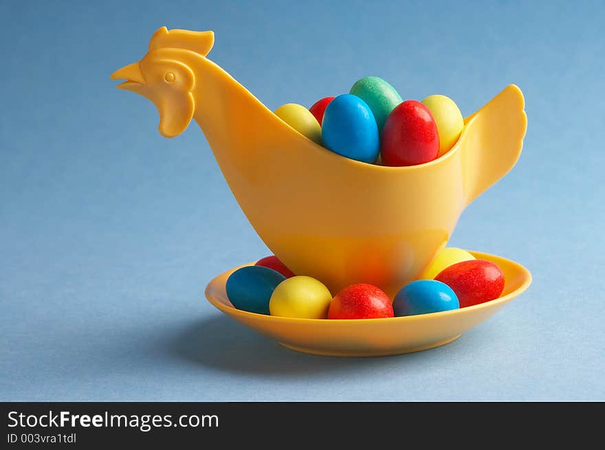 Yellow plastic- chicken with little choco eggs in it. Yellow plastic- chicken with little choco eggs in it