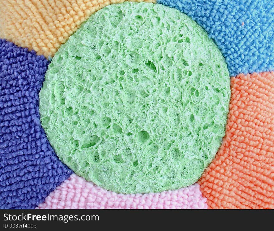 Colored flower shaped sponge closeup. Colored flower shaped sponge closeup