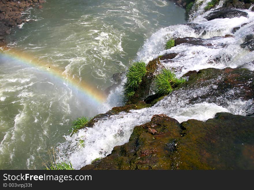 Waterfalls at Iguacu, Brazil/Argentina with beautiful rainbow. Waterfalls at Iguacu, Brazil/Argentina with beautiful rainbow.