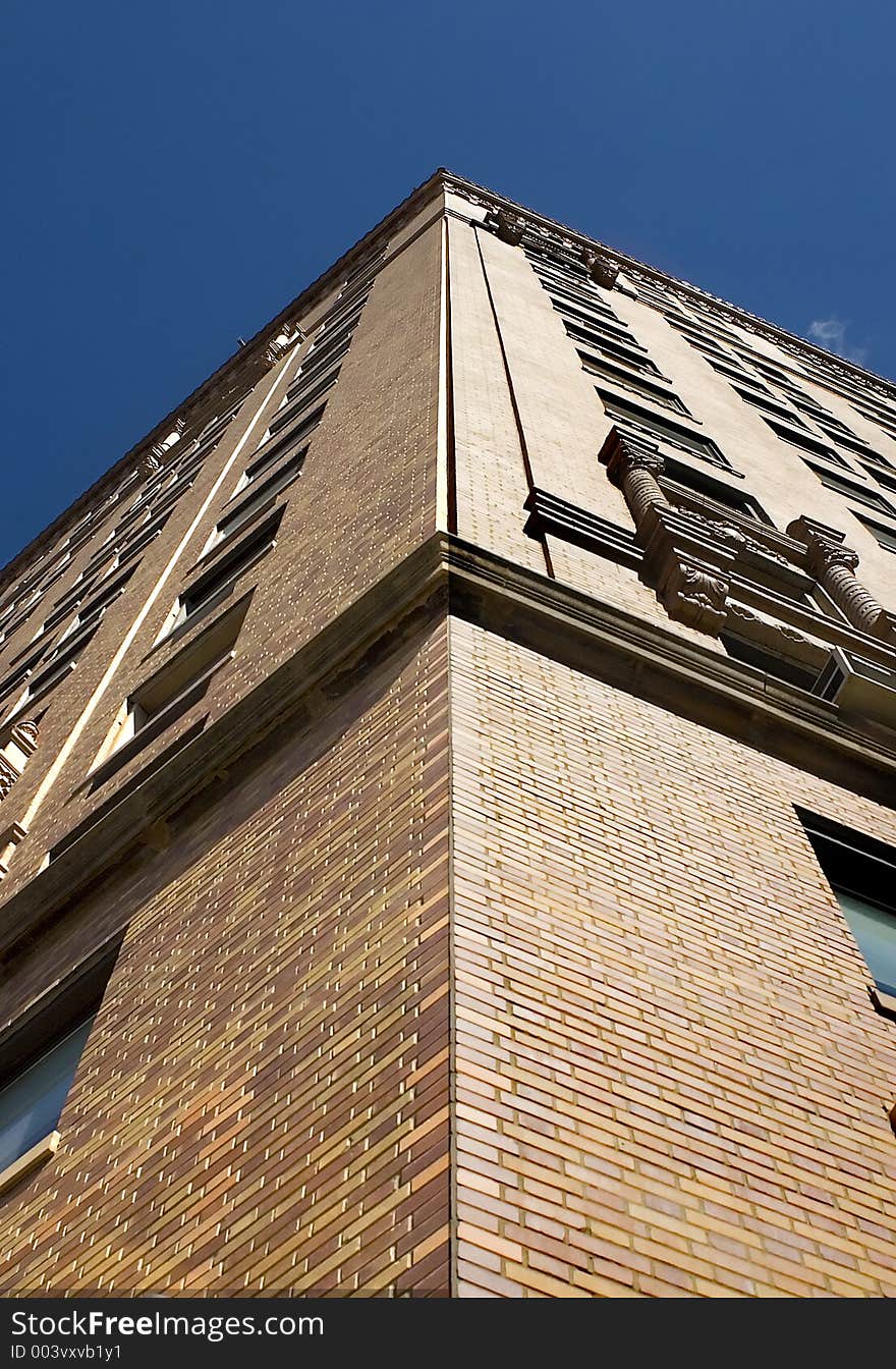 Corner of the building against a blue sky.