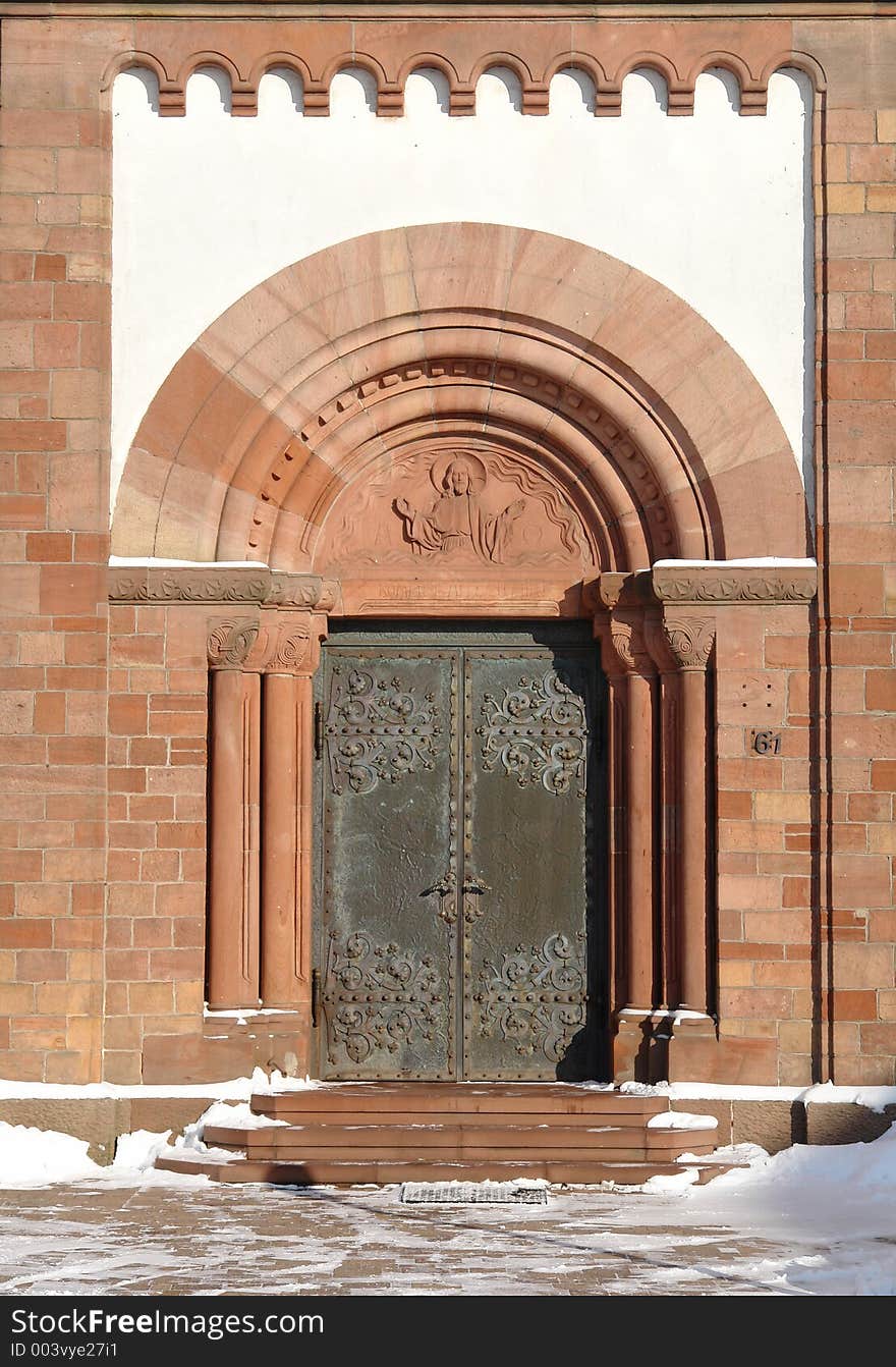 The brass and stone gate of the Catholic church at Martinshoehe in the Palatinate area of Germany which was built in the 19th century. The brass and stone gate of the Catholic church at Martinshoehe in the Palatinate area of Germany which was built in the 19th century