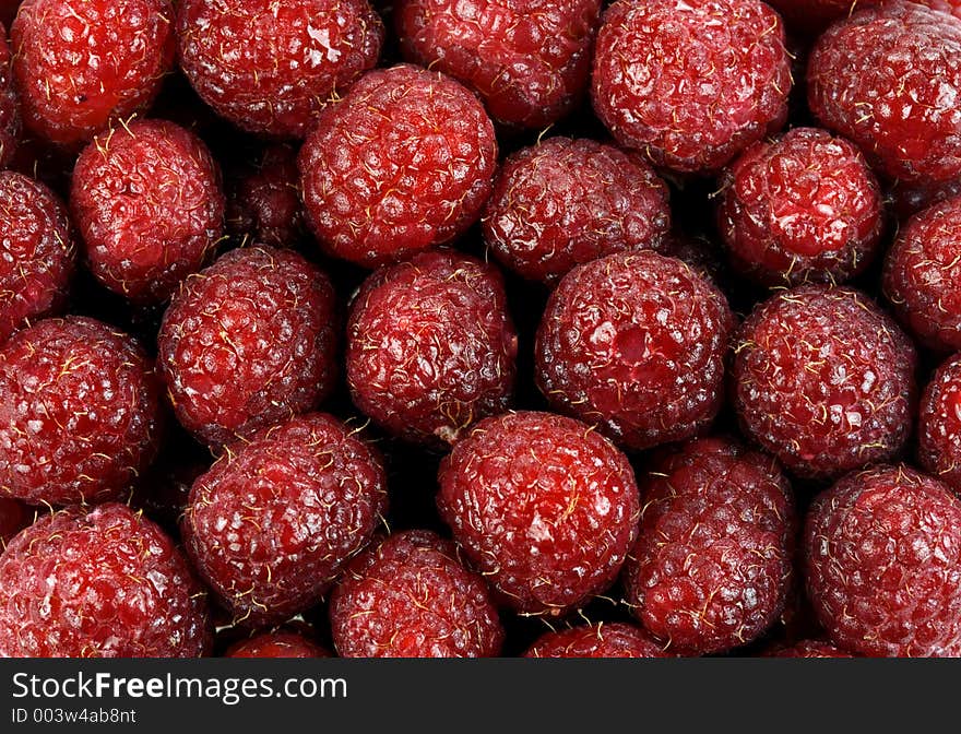 Pile of red luscious raspberries