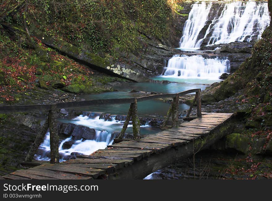 Waterfall with the wood bridge. Waterfall with the wood bridge