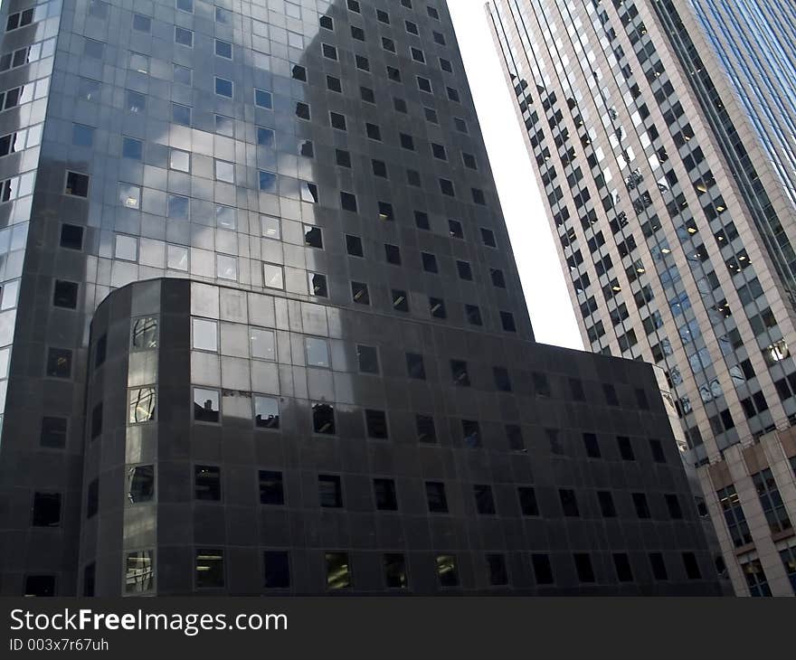 This is a shot of a group of modern reflecting buildings in Manhattan. This is a shot of a group of modern reflecting buildings in Manhattan.