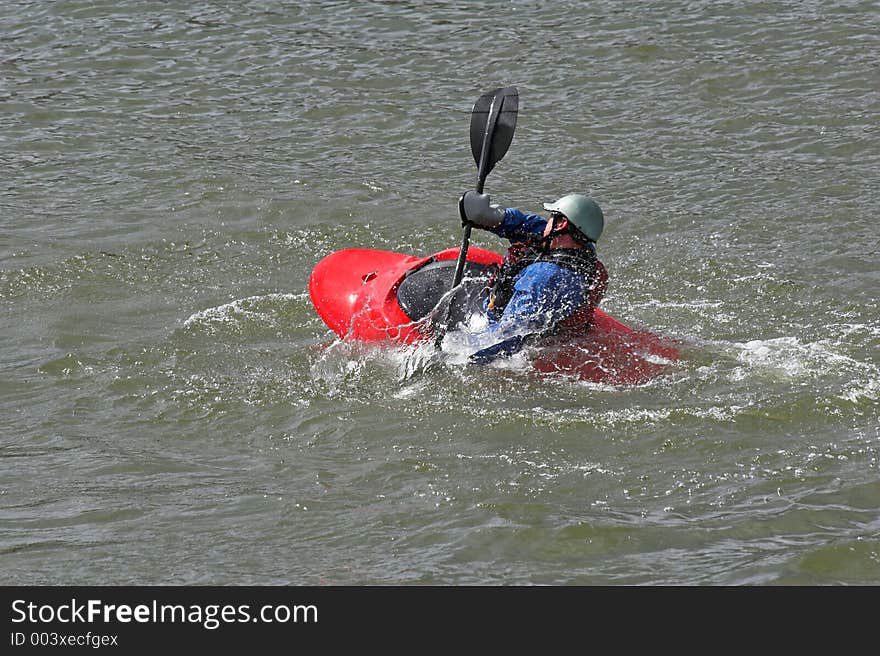 Kayaker practicing recovery from roll over. Kayaker practicing recovery from roll over