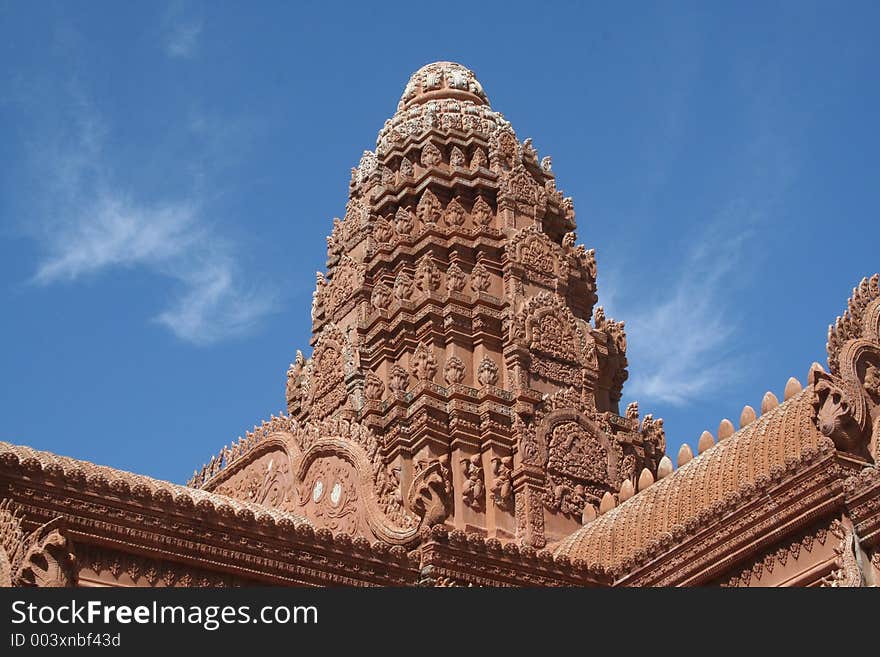 The dome of a Cambodian Wat with 5 headed cobras littering the entire dome.