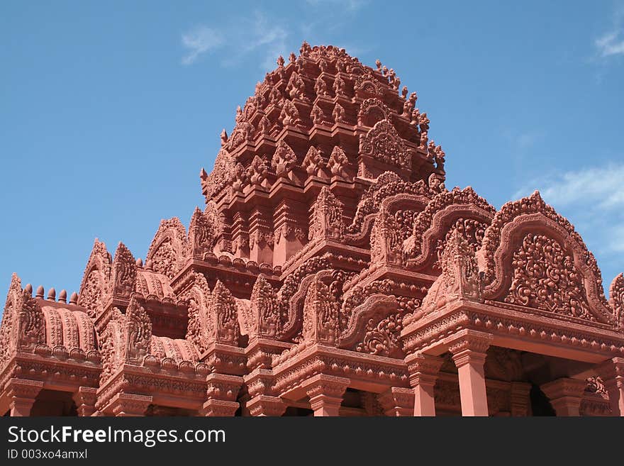 A buddhist temple in Cambodia with 5 headed cobras on the top