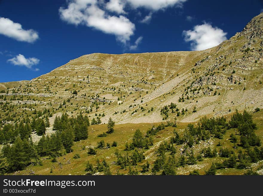 Rocky mountainsides on a sunny day. Rocky mountainsides on a sunny day.