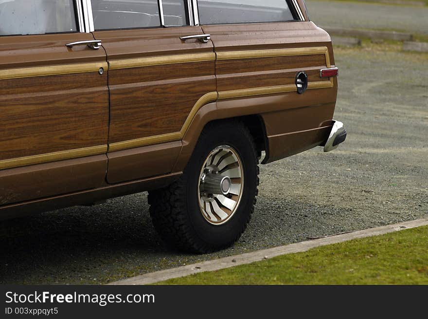 Fake wood panelling on the side of a large seventies family wagon. Fake wood panelling on the side of a large seventies family wagon