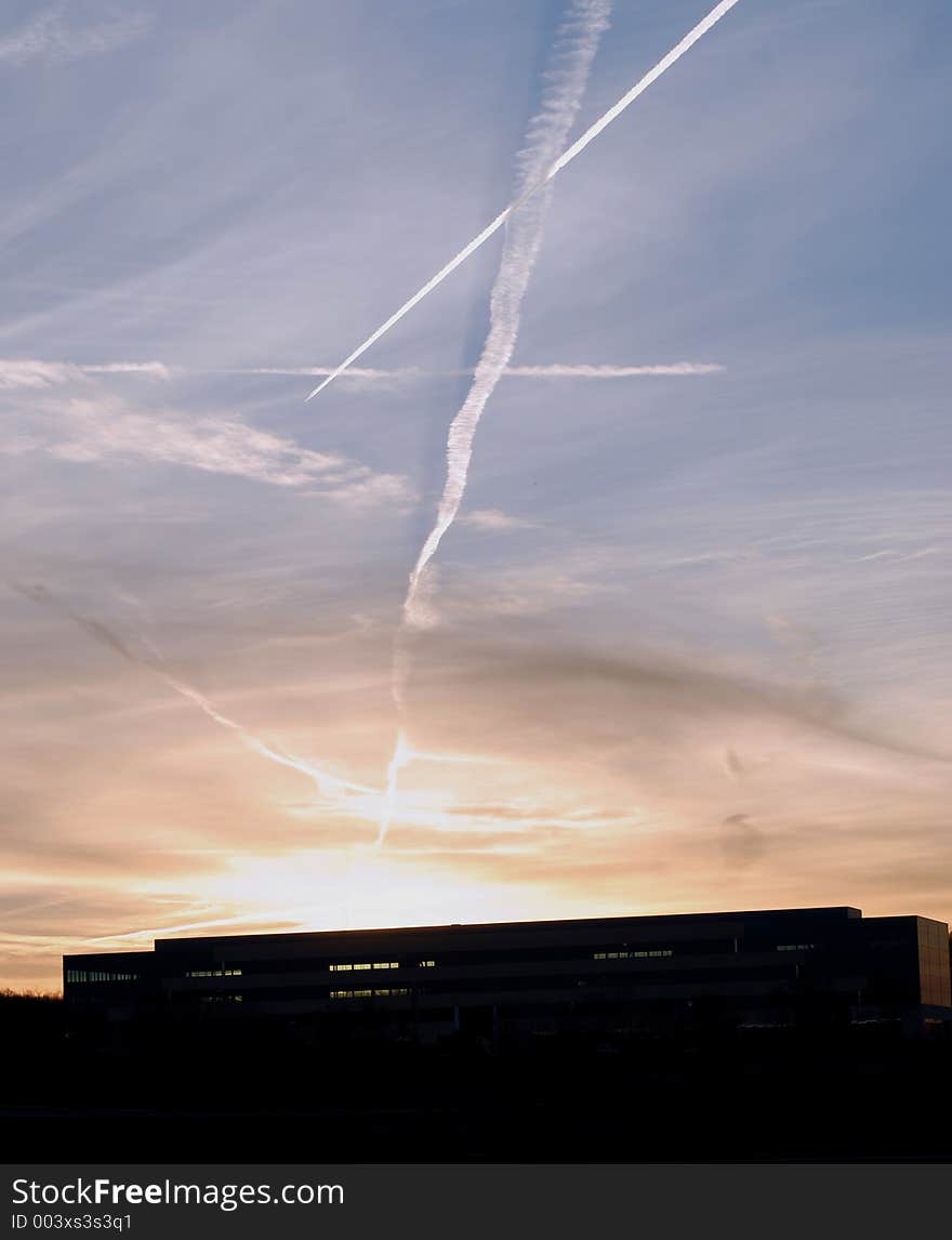 Taken at sunset, silhouetting a local building. Taken at sunset, silhouetting a local building.