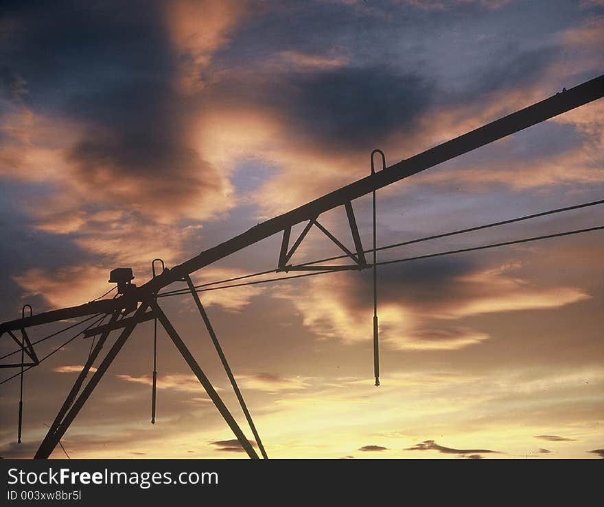 Farm water pipe at sunset