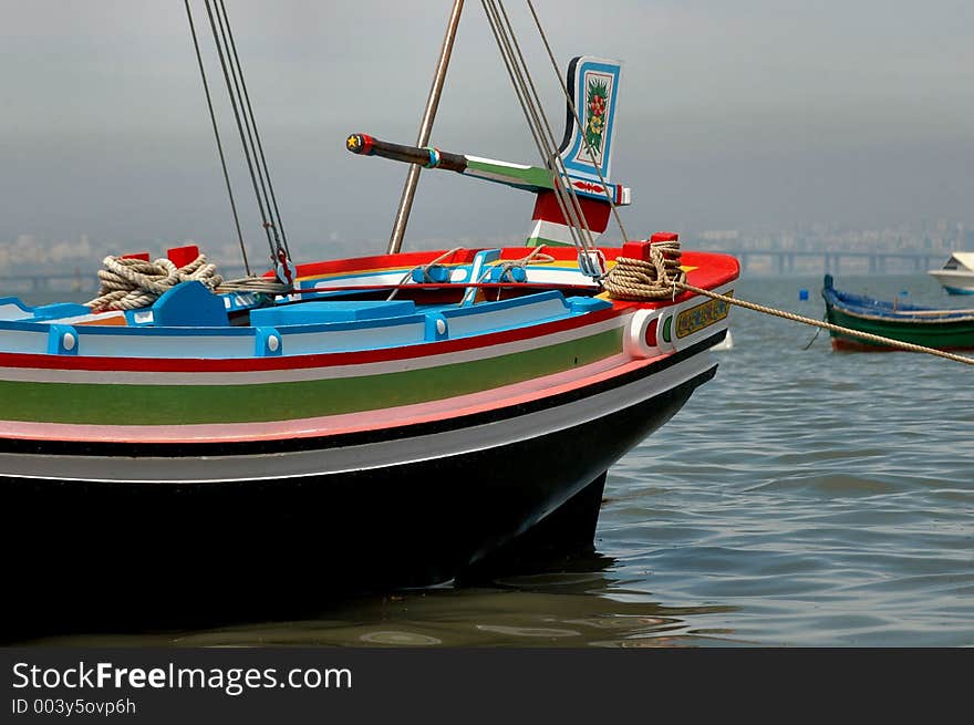 Alcochete,Portugal,E.U.. River barge replica of old barges crossing Tagus River,Portugal, with passengers and goods.