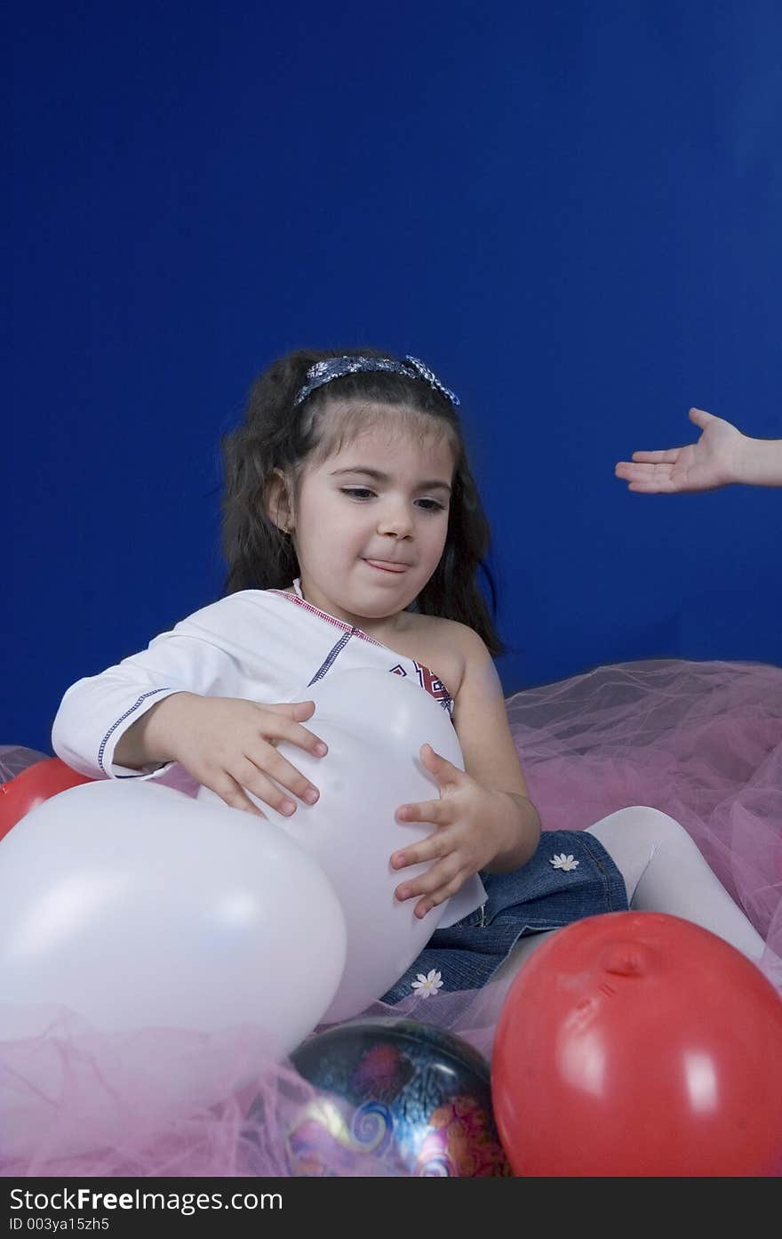 Little pretty girl holding a balloon. Little pretty girl holding a balloon