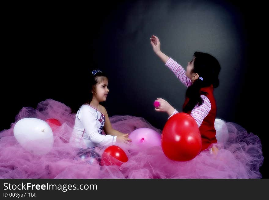 Girls playing with balloons