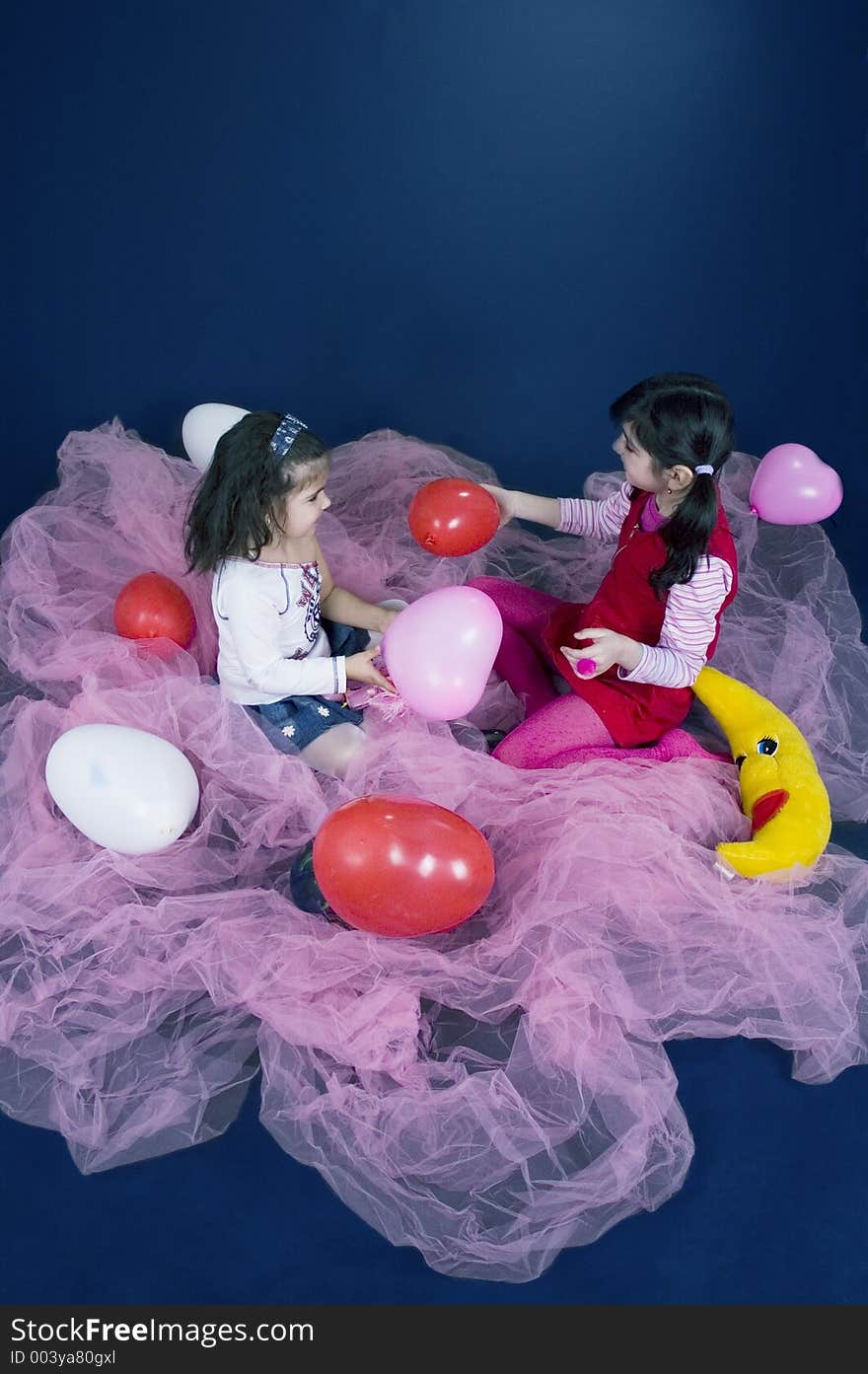 Girls playing with balloons