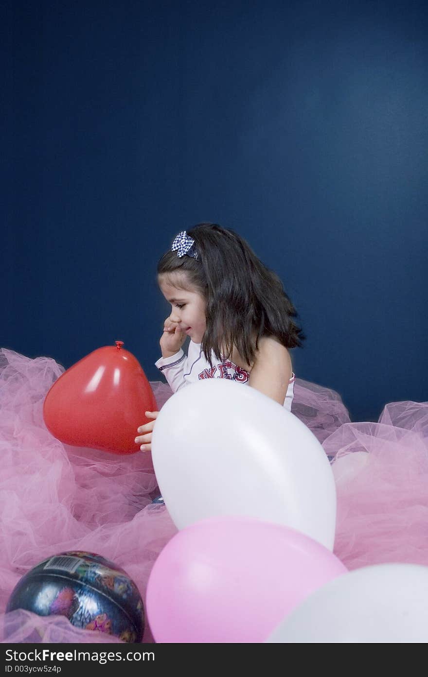 Pretty little girl playing with ballons. Pretty little girl playing with ballons