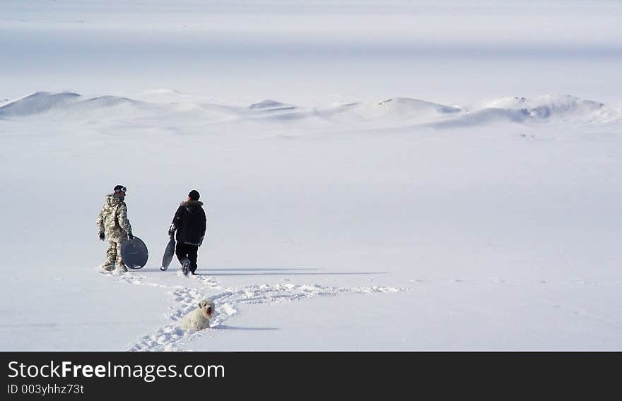 Two boys walking on inocent snow covering Baltic sea. Two boys walking on inocent snow covering Baltic sea