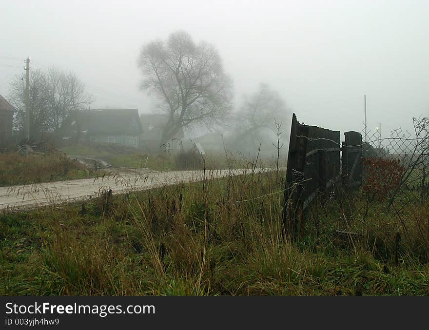 The image of a village in a fog. The image of a village in a fog