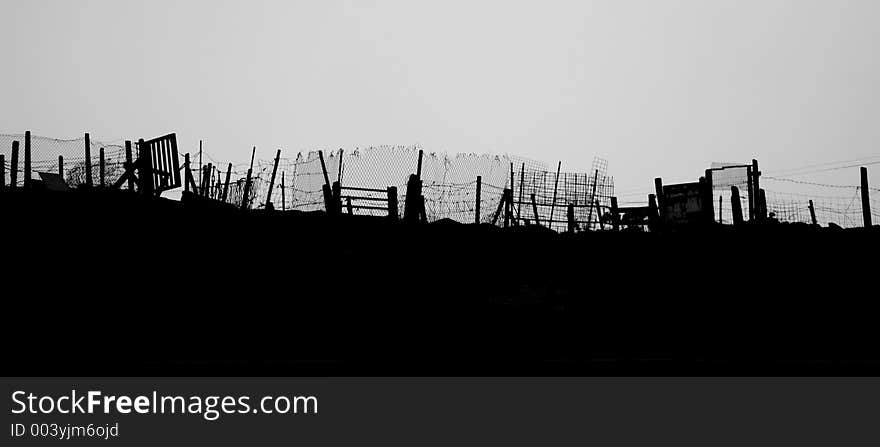 Makeshift fences and gates on a hilltop in South Wales, UK. Makeshift fences and gates on a hilltop in South Wales, UK.