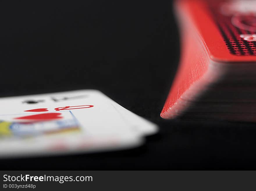 Playing cards on black background