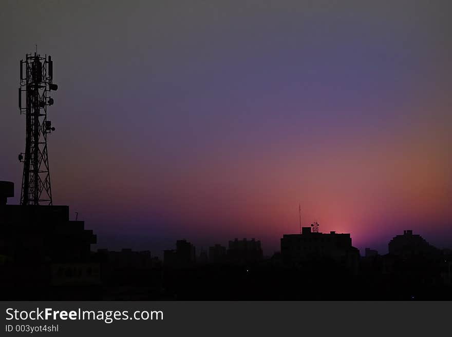 Sunsets and sunrise hues in skies over modern cities India. Sunsets and sunrise hues in skies over modern cities India