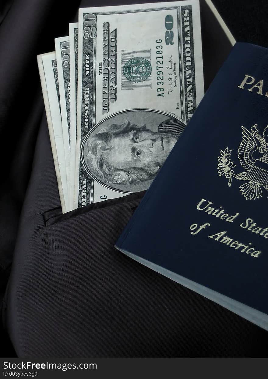 Dollars and passport in a suit