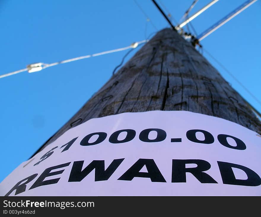 Shallow depth of field. focus on the lettering. pole goes out of focus pointing towards the sky and meeting with it's supporting lines. Shallow depth of field. focus on the lettering. pole goes out of focus pointing towards the sky and meeting with it's supporting lines.