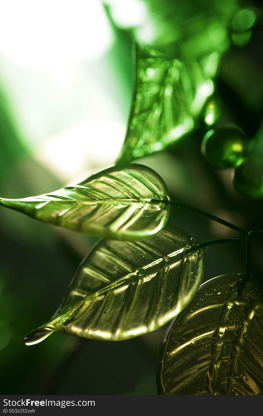 Green glass leaves with selctive focus and narrow depth of field for effect. Green glass leaves with selctive focus and narrow depth of field for effect