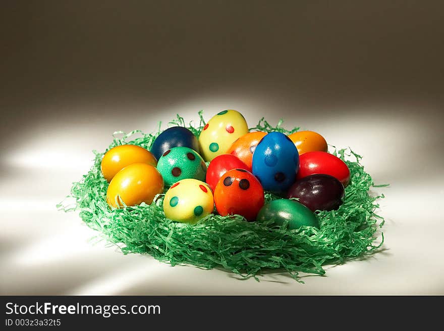 Coloured easter eggs in green grass