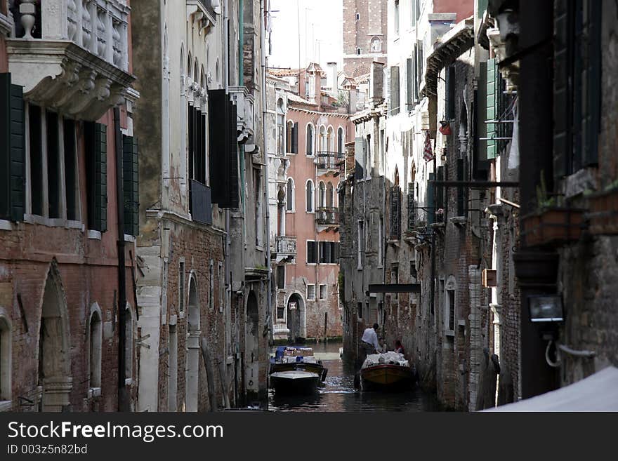 The small canals of venice are typical for this city. The small canals of venice are typical for this city