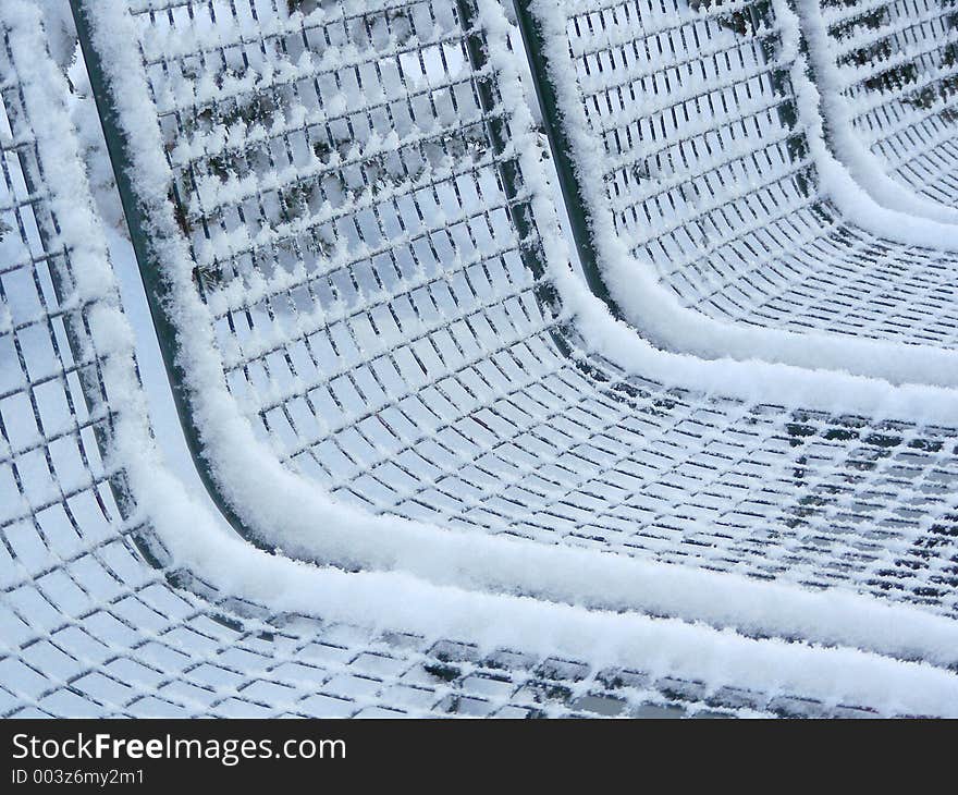 Bench covered with snow