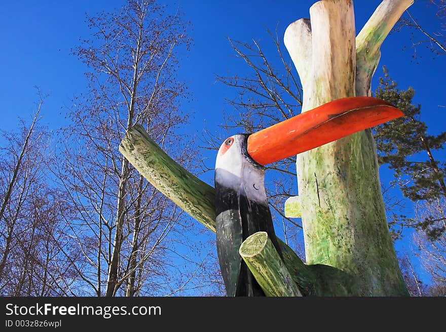 Wooden bird and blue sky