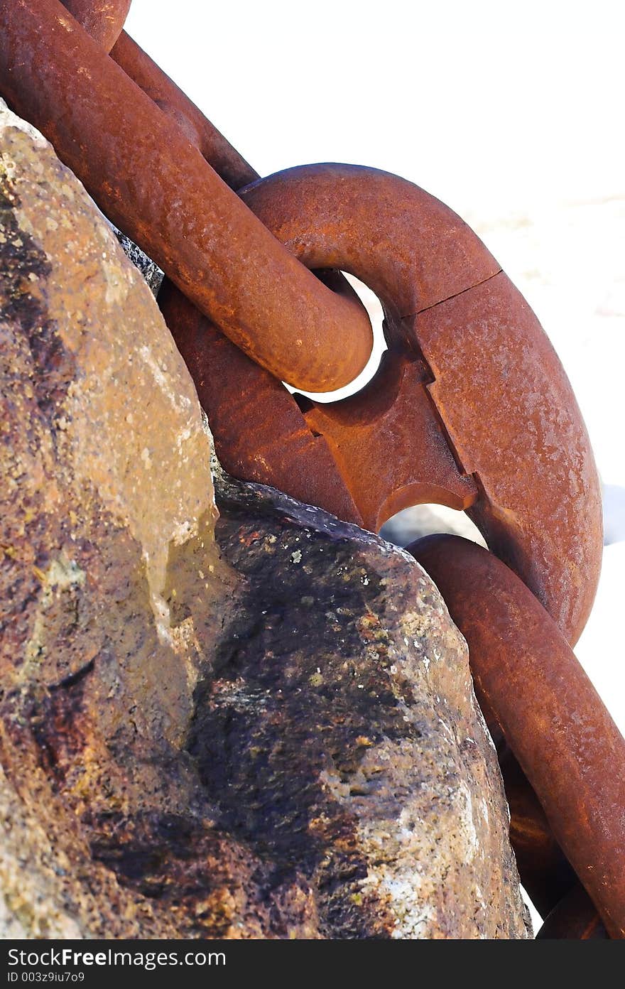 Heavy anchor chain over the stone. Heavy anchor chain over the stone