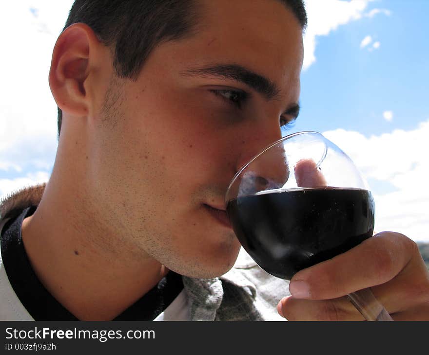 Young man drinking beverage