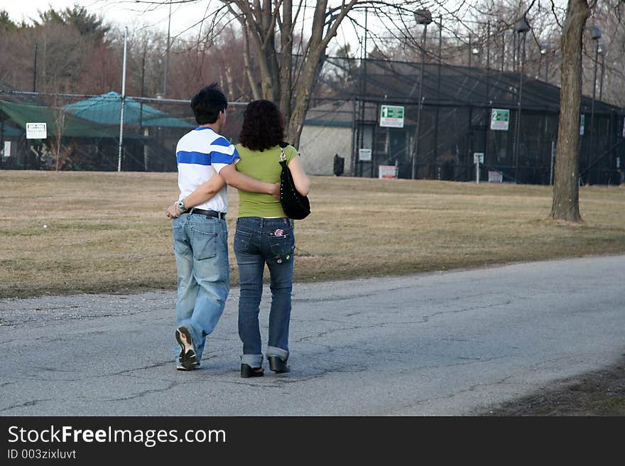 Couple holding each other while walking. Couple holding each other while walking