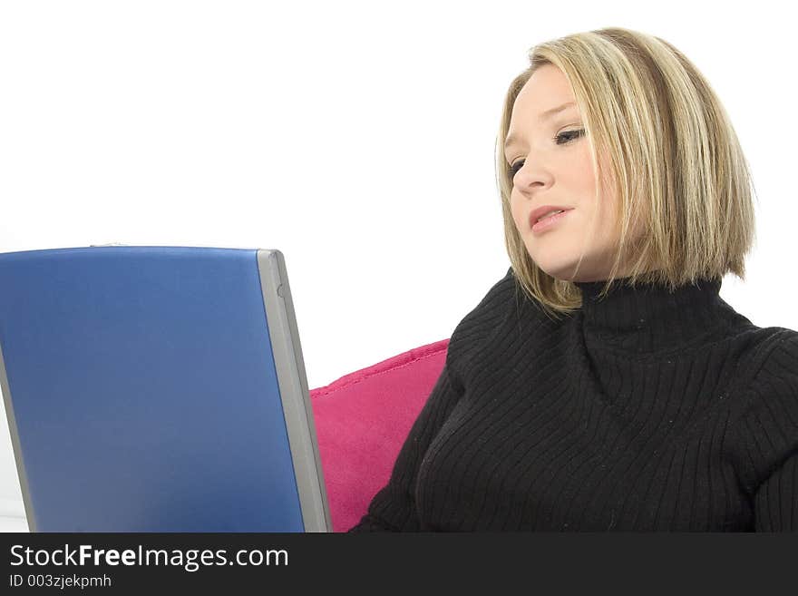 Beautiful young blonde woman working with laptop. Shot in studio. Beautiful young blonde woman working with laptop. Shot in studio.