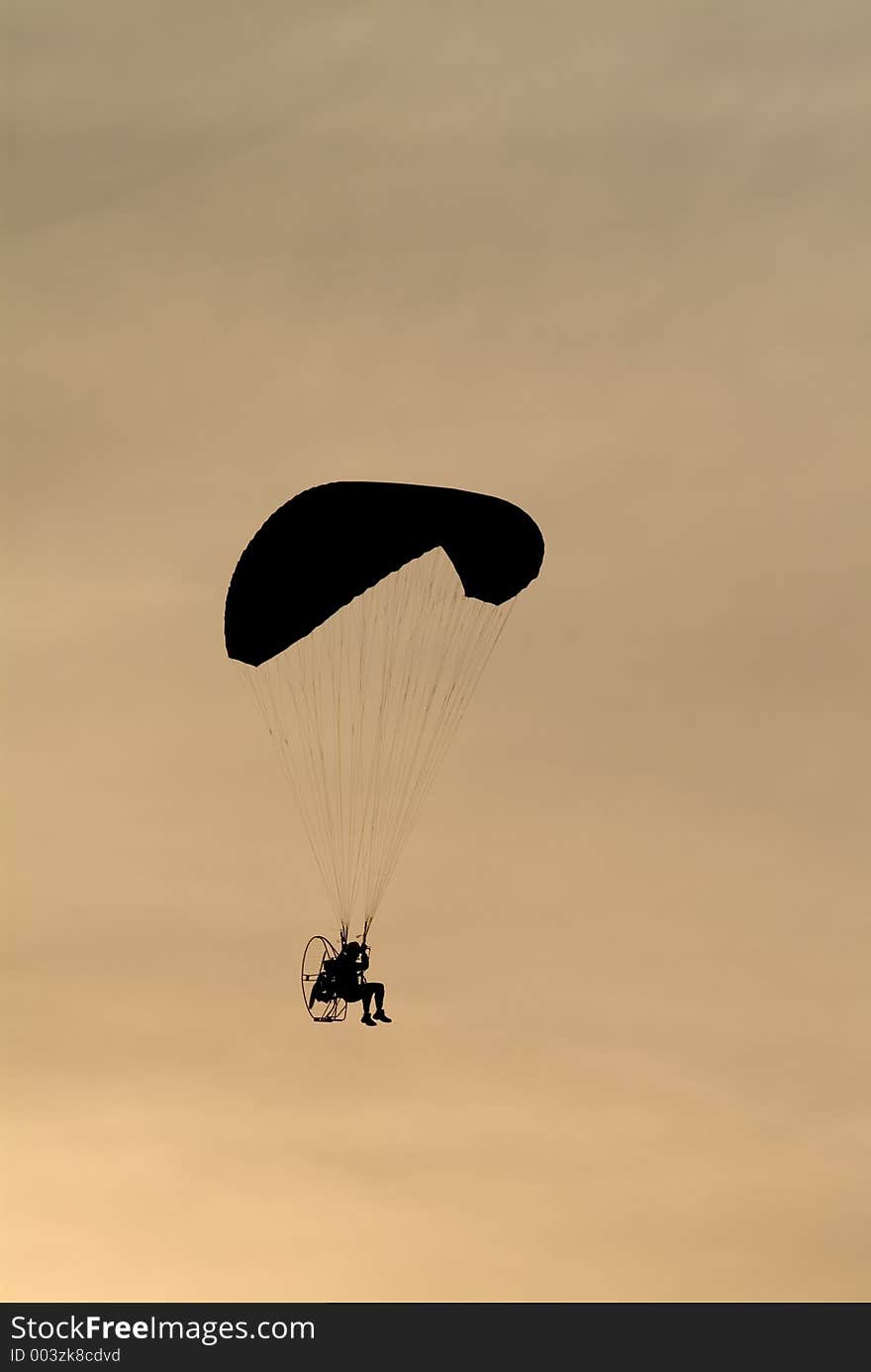 Man flying his paraplane. Man flying his paraplane.