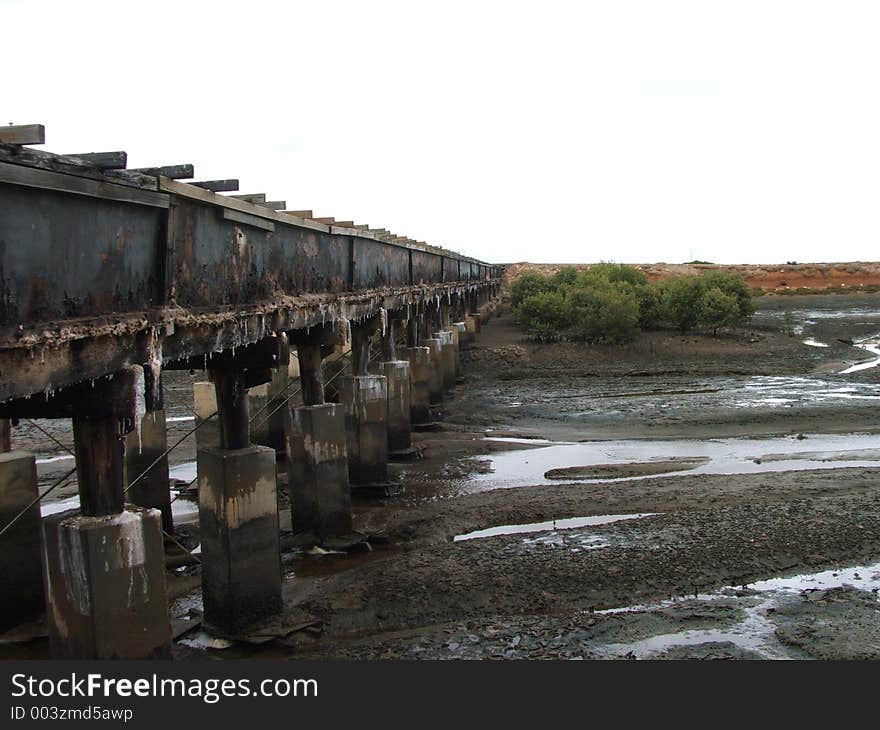 Disused bridge over a mangrove creek. Disused bridge over a mangrove creek