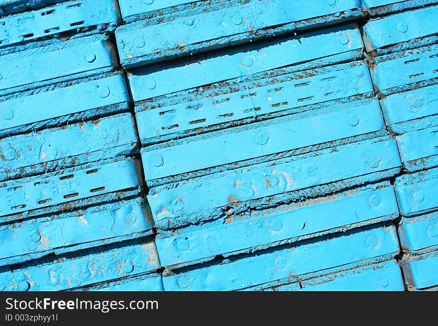 Abstract pattern of blue painted plank ends. Abstract pattern of blue painted plank ends.