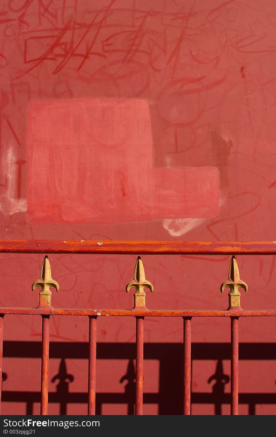 Red iron railings on red background. Red iron railings on red background.