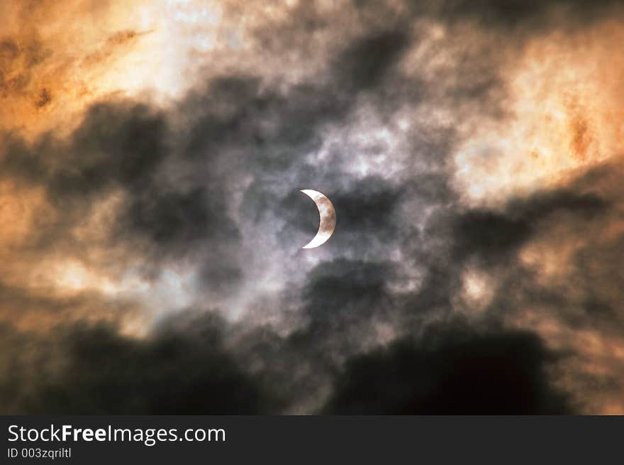 Eclipse seen through the clouds. Shot in Bucharest, Romania, March 29,2006.