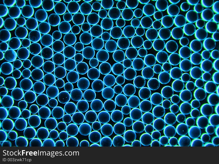 Glass beads with the background blue light