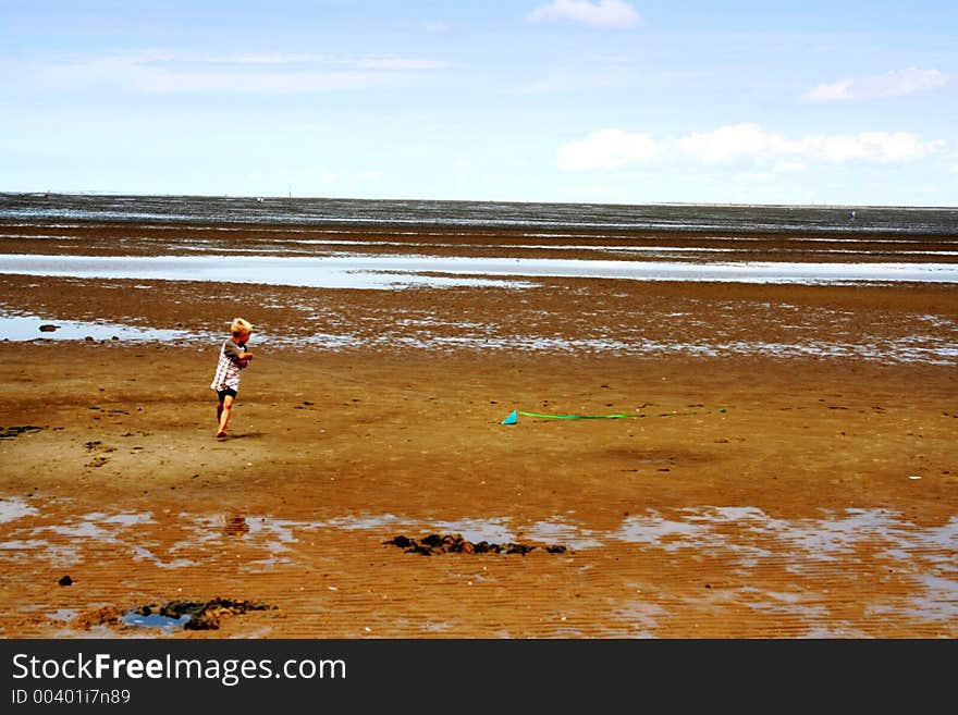 Boy Flying a Kite at The North Sea