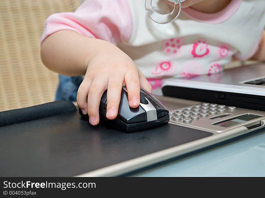 Little baby working on notebook. Little baby working on notebook